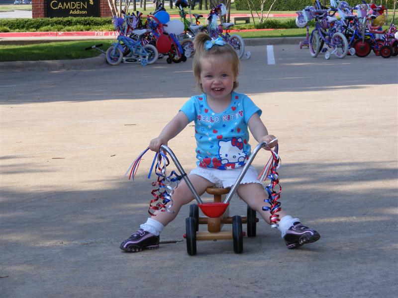 Jess_Daycare-BikeParade (16).JPG - Check out my sweet ride complete with the "Flintstone" Brake System!